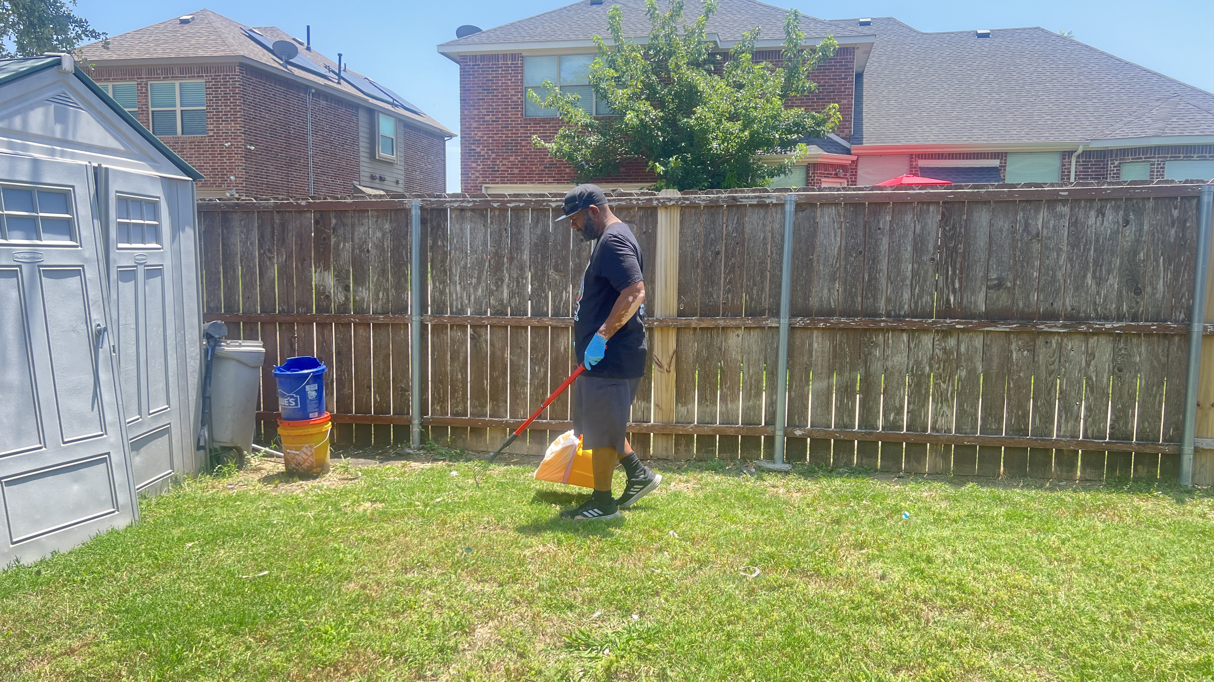 Poop Savvy cleaning a backyard on a sunny Saturday